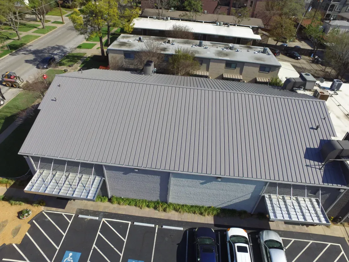 Aerial view of a commercial metal roof in Fort Worth, TX installed by JC Roofing
