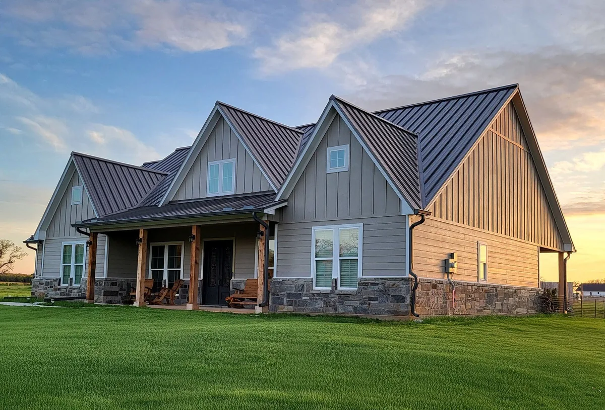 Modern Texas home with a custom standing-seam metal roof by JC Roofing