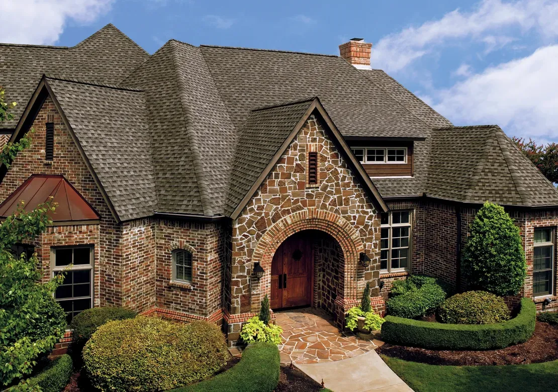 New roof installation on a stone-front Fort Worth home